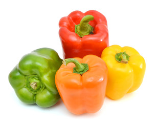 colorful peppers over white background