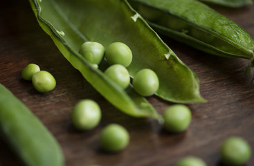 Close up of a green pea pod food photography recipe idea