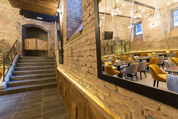 Fototapeta na wymiar Stairs in modern restaurant