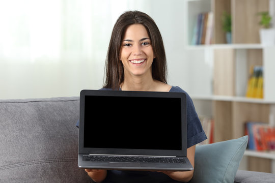 Teen showing a blank laptop screen mockup