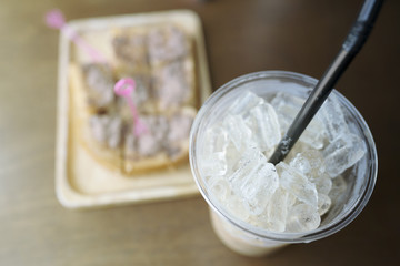 ice coffee and toasted bread on table