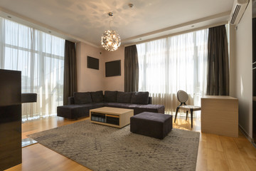 Interior of a modern open plan hotel apartment, living room