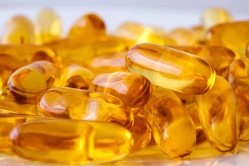 Close up the vitamin D and Omega 3 fish oil capsules supplement  for good brain , heart and health...