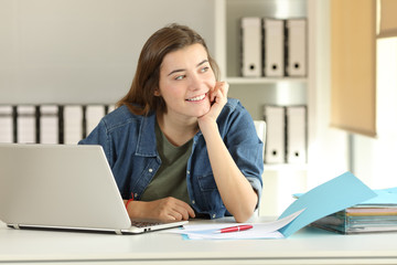 Intern dreaming looking at side at office