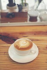 Cup of coffee latte in coffee shop