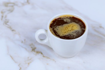 Close up white coffee cup on stone table background view