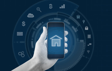 Smart home and buildings mobile application. Hand holding mobile smart phone 