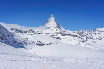 The observatory on Gornergrat Summit overlooking Matterhorn as background in Zermatt, an iconic emblem of the Swiss Alps in canton Valais, Switzerland