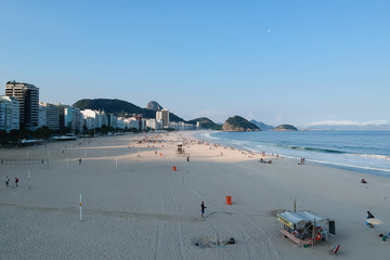aerial drone view of Copacabana beachs during late afternoon,, some shadows can be seen on the sand. Rio de Janeiro, Brazil