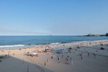 aerial drone view of Copacabana beachs during late afternoon,, some shadows can be seen on the...