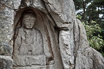 Fototapeta na wymiar A statue of Buddha in Bulgok, Namsan Mountain, Gyeongju, Korea.
