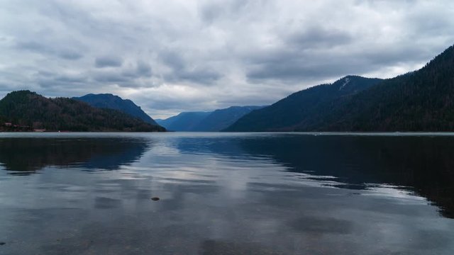 Teletskoe lake in cloudy weather in the spring. 4K timelapse