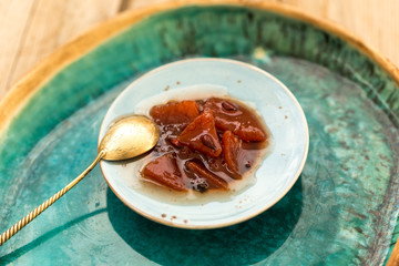 Quince jam in small ceramic plate