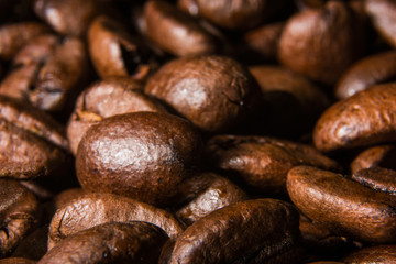 Background of roasted coffee beans is macro