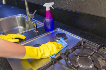 Great concept of domestic cleaning, woman cleaning the sink