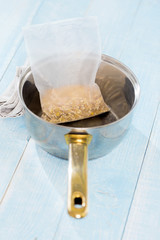 Healthy raw quick cooking grain in the casserole, top view. Pearl barley, bulgur wheat, green lentils. Healthy food concept