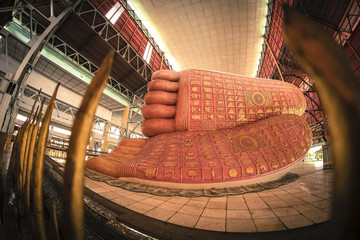 Fototapeta na wymiar The little known Chaukhtatgyi Temple in Myanmar capital city Yangon has one of the biggest and most graceful Reclining Buddha statues in South East Asia