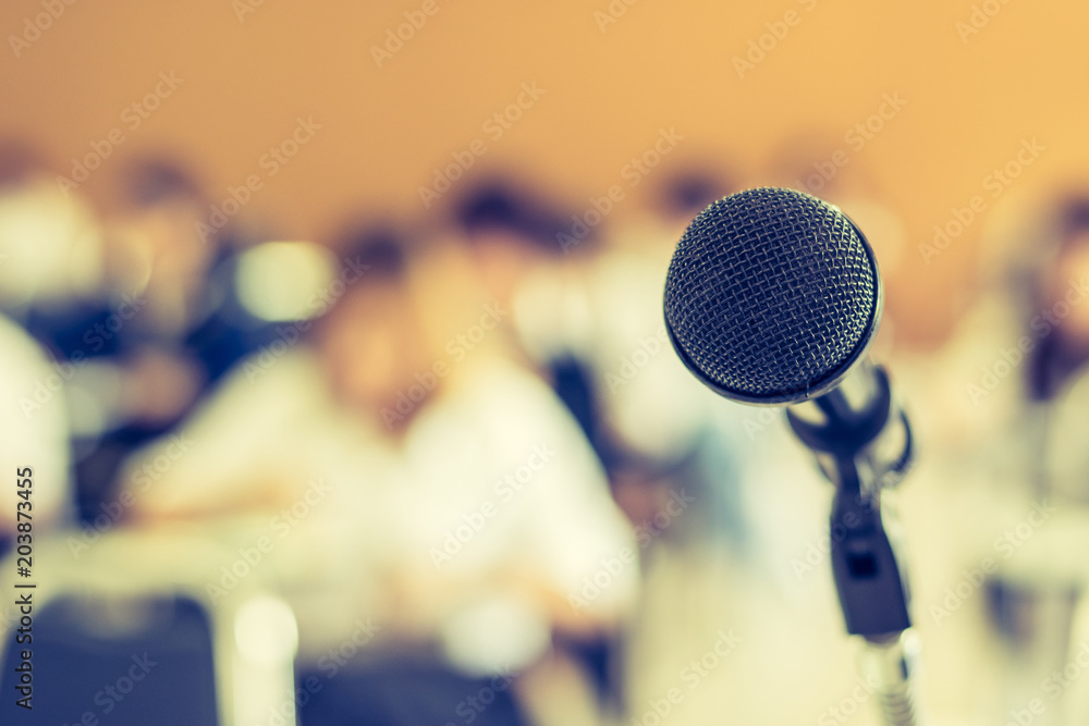 Wall mural Microphone voice speaker with audiences or students in seminar classroom, lecture hall or conference meeting in educational business event for host, teacher, or coaching mentor