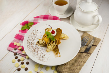 pancakes with banana and whipped cream