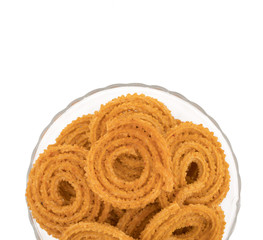 Indian Traditional Snack Chakli, a spiral shaped crisp deep fried snack, It is known as  Chakali, Murukku, Muruku, Murkoo, Chakri in Gujarat, Chakli in Maharashtra and Northern India