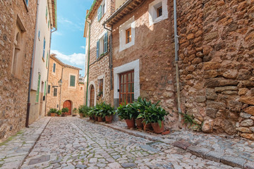 Fototapeta na wymiar Biniaraix village cobbled street. Soller municipality in Majorca Balearic Islands.