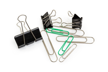 Different binder clips and paper clips on a white background