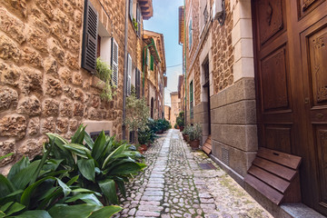 Silent cobbled narrow street in Fornalutx village, Majorca Balearic Islands