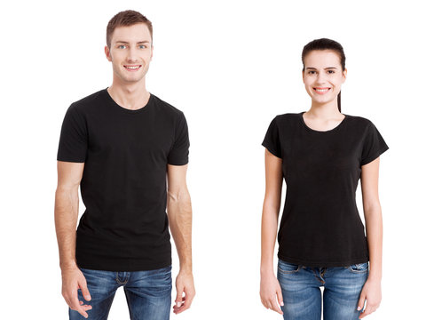 Shirt design and people concept - close up of young man and woman in blank black t-shirt front isolated.