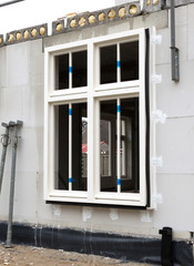 Building site with house under construction