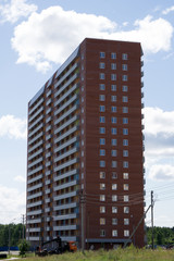 Fototapeta premium Multi-storey residential apartment buildings over blue sky .