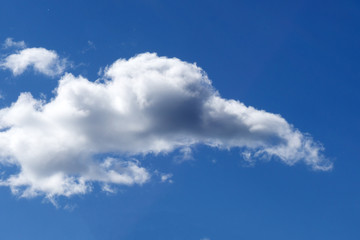 Aerial view on white fluffy clouds .