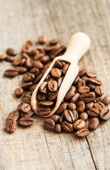 Coffee beans on wooden background