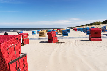Red beach chairs on a sunny day at the Baltic Sea