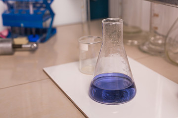 Laboratory flask with blue liquid