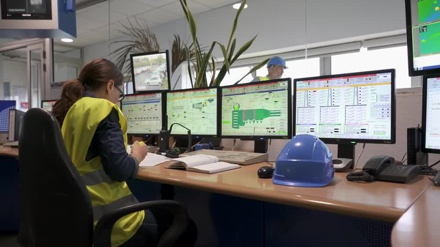 Industrial technician working in monitoring control room