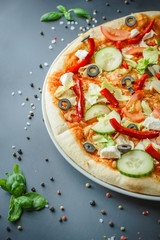 greek pizza on dark background