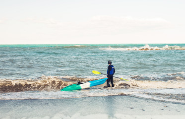 Kayaker holding his kayak