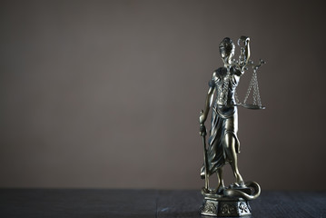 Legal office of lawyer. legal model statue of Themis goddess of justice.