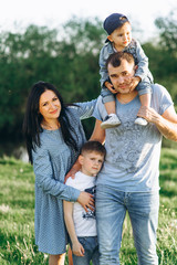 Family Dad Mom and Children in the Field