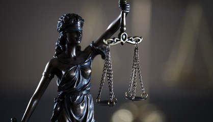 Legal office of lawyer. legal model statue of Themis goddess of justice.