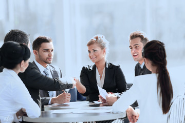 business people shaking hands during meeting at creative office
