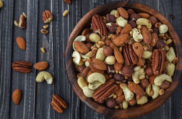 Nuts mix in a wooden plate