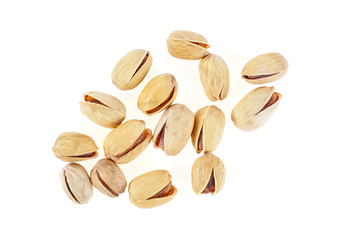 Dry salted pistachio nuts isolated on white background. Top view.