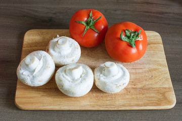 mise en place setup of ingredients for dinner on wooden cutting board before preparation, bacground diet lifestyle