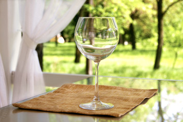 empty goblet on high stalk empty in gazebo
