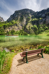 Small wooden bench at the Konigssee lake, Alps, Germany
