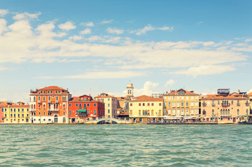 Fototapeta na wymiar Picturesque summer view of Venice with famous water canals and colorful historical buildings.