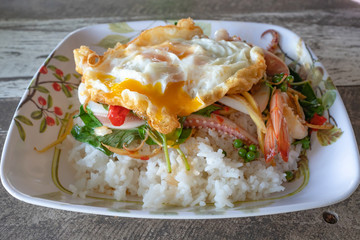 Stir-fried sea food and basil leaves- Served with rice