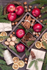 Holidays composition with christmas fruits, nuts and gift box