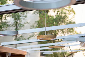 Obraz na płótnie Canvas Ceiling lights in summer terrace restaurant